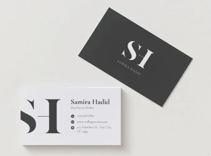 Black and white business cards with real estate agent initials and contact info.