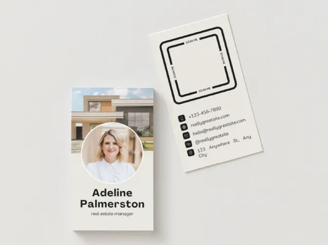 Business card with agent headshot and building in background.